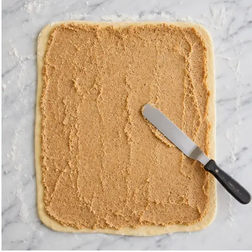 Step 2: Rolling and spreading the almond filling