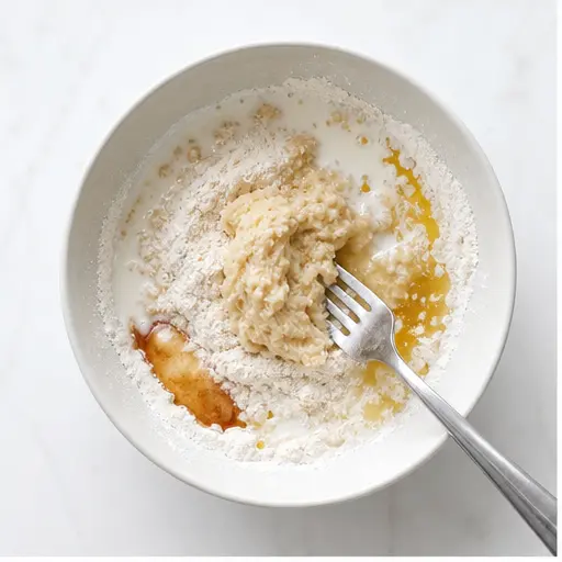 Step 1: Whisking together the dry and wet ingredients for the dough