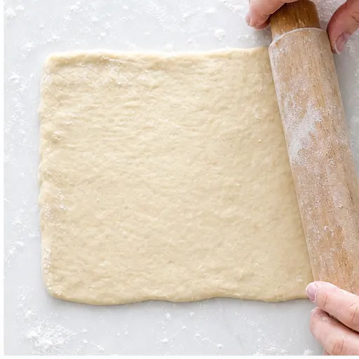 Step 2: Patting the dough into a rectangle on a floured surface