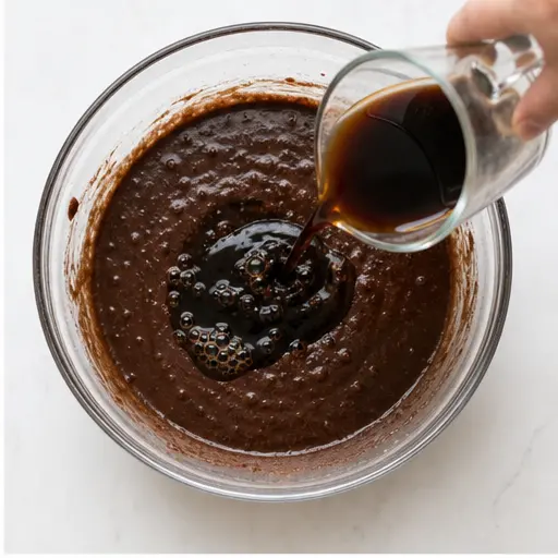 Step 2: Adding hot coffee to the chocolate batter