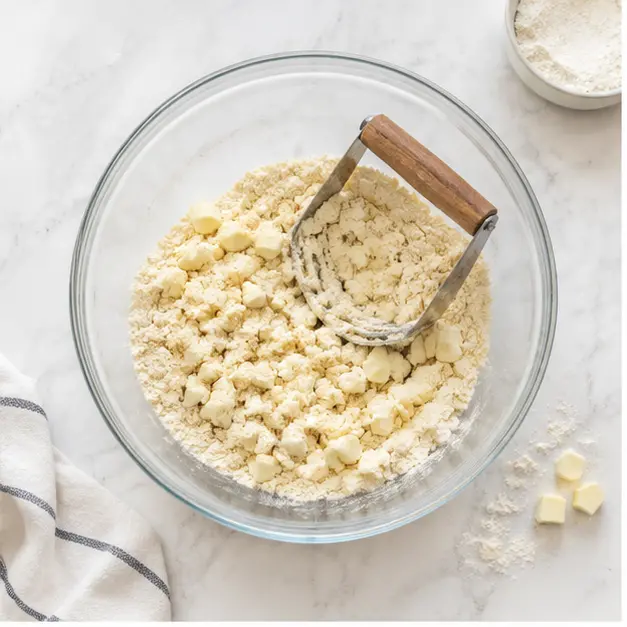 Step 1: Cutting butter into flour for biscuit dough