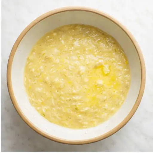 Step 2: Whisking together wet ingredients with mashed bananas