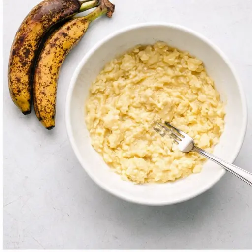 Step 2: Mashing ripe bananas with a fork
