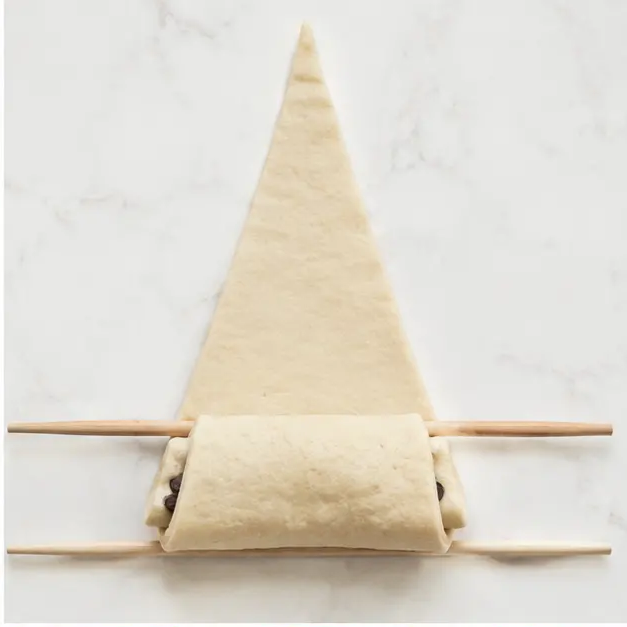 Step 2: Rolling the pastry into croissant shapes