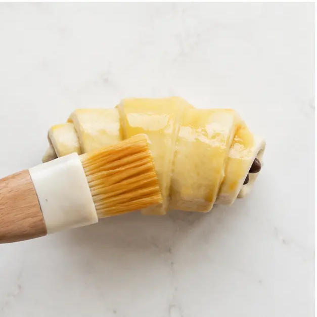 Step 3: Brushing with egg wash for golden shine