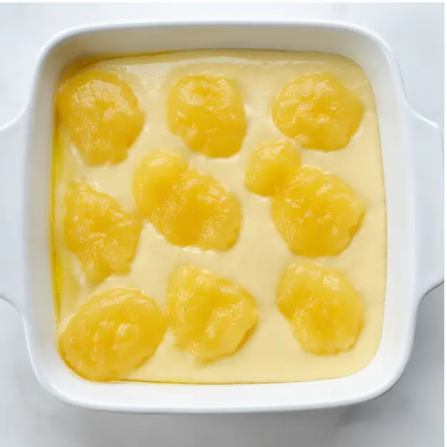 Step 3: Dropping lemon pie filling over batter