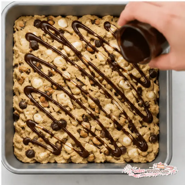 Step 4: Drizzling chocolate syrup over the dough before baking