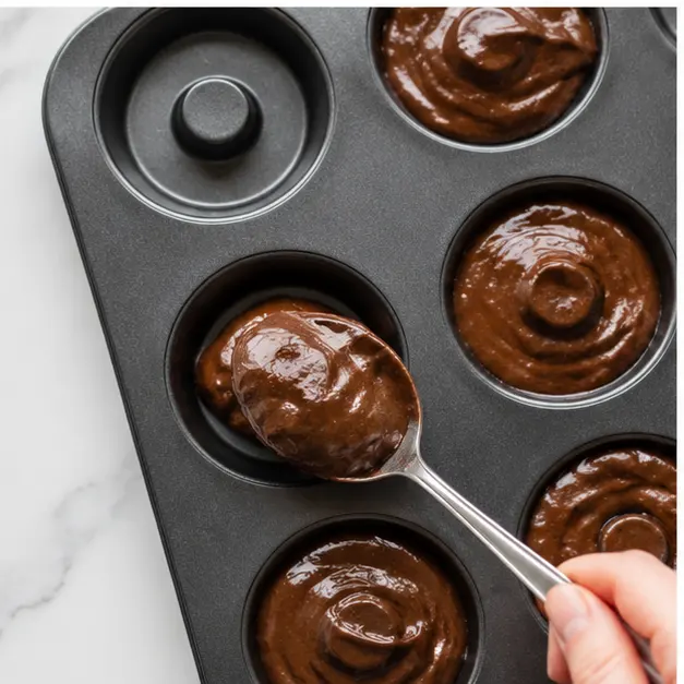 Step 3: Spooning batter into donut pan