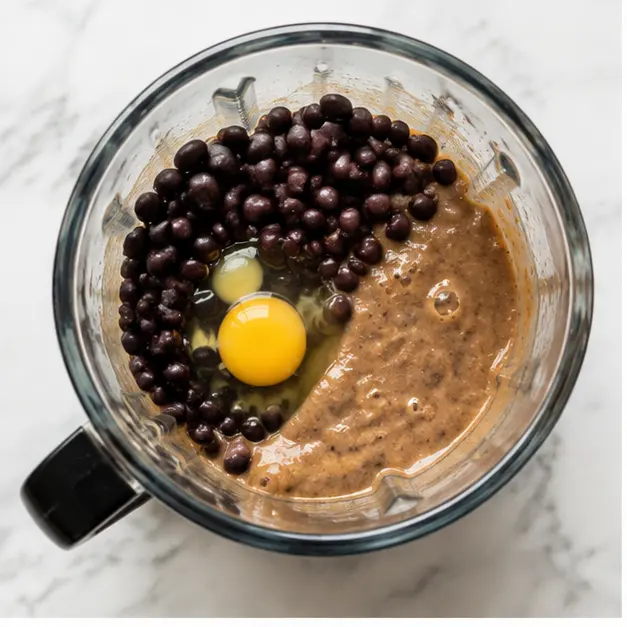 Blend black beans and one egg until completely smooth