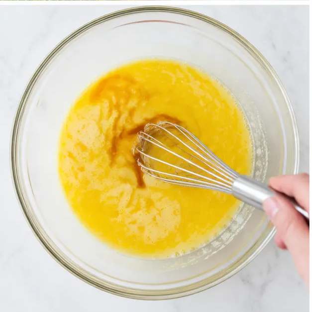 Whisk the eggs with melted butter, avocado oil, and vanilla