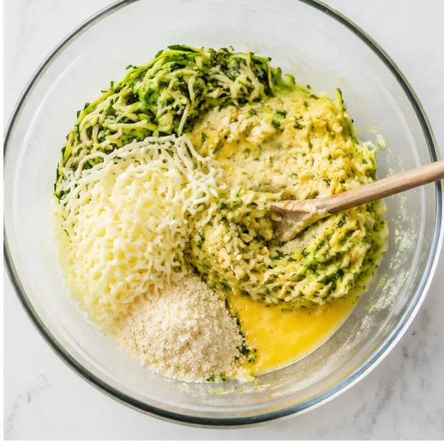 Step 2: Mixing zucchini, cheeses, egg, and garlic parsley salt