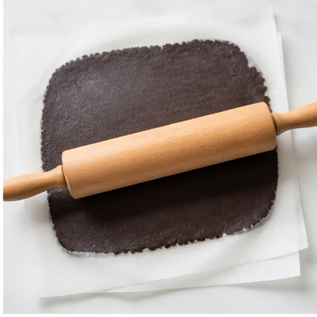 Step 2: rolling the dough flat between parchment sheets