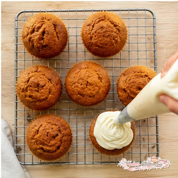 Step 4: Pipe cream cheese frosting on cooled muffins