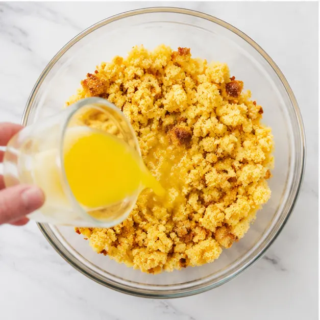 Step 3: Melting butter into the crumbled cornbread