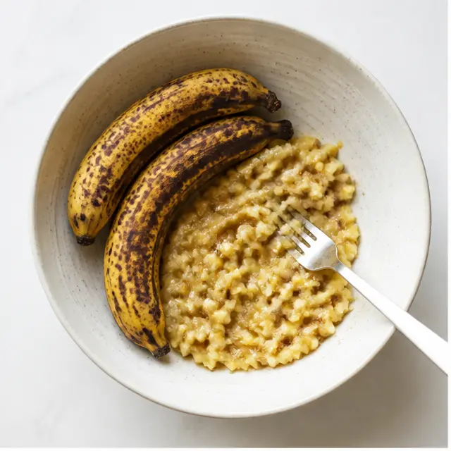 Mash three spotty overripe bananas with a fork until mostly smooth