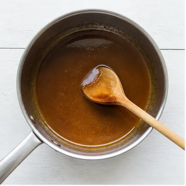 Melting the brown sugar caramel topping in a saucepan