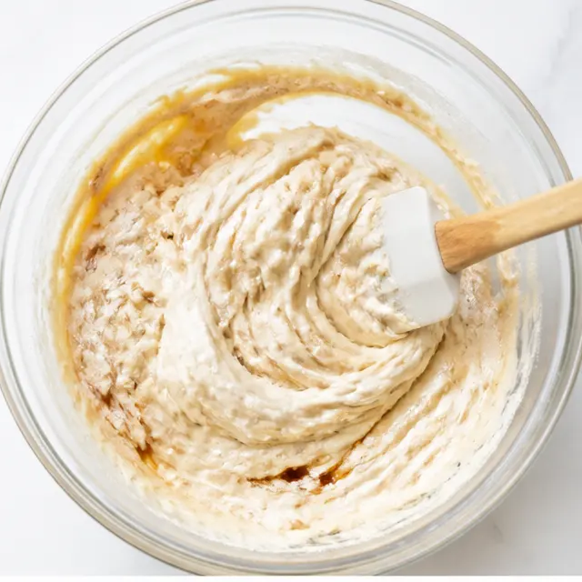 Mixing the wet batter with sour cream until smooth