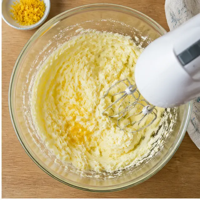 Cream butter, sugar, and lemon zest until pale and fluffy